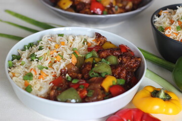 Wall Mural - Vegetable Carrot Fried Rice with Indian spices served along with chilly chicken.