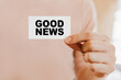 © Daria Lukoiko - Man holding a business card with Good News