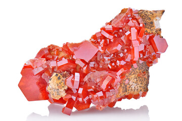 Wall Mural - Amazing natural red raw vanadinite mineral stone closeup macro isolated on white background. Orange rough vanadium crystals. 