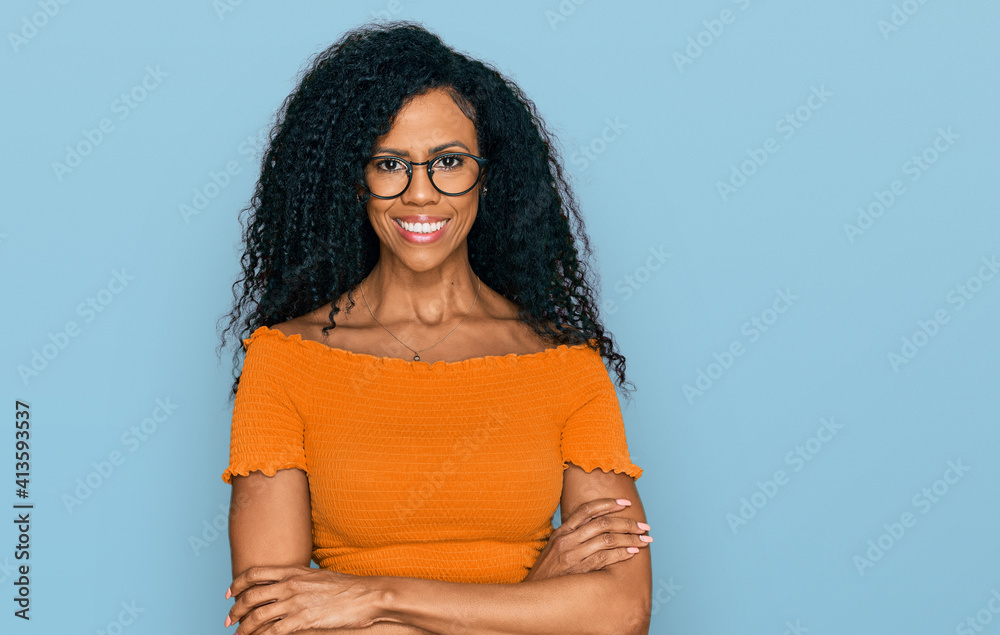 Middle age african american woman wearing casual clothes and glasses ...
