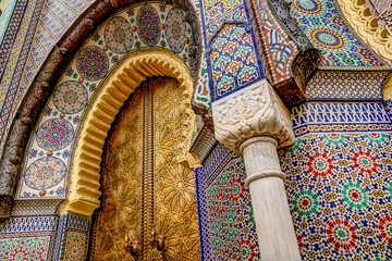 intricate tile patterns, metal work and plaster carvings adorning building exteriors in fez morocco