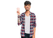 © Krakenimages.com - Young hispanic man wearing casual clothes showing and pointing up with fingers number three while smiling confident and happy.