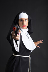 Portrait of a disguised nun on black background