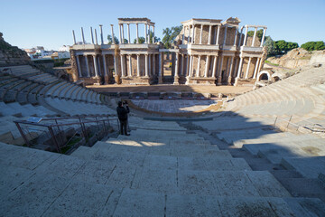  Visitor taking pictures to Merida Roman theatre. Extremadura, Spain