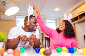 african american man preparing for Easter in apartment