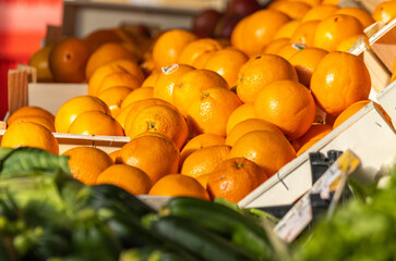 Oranges on display at farmers market, for sale, fresh and healthy food.