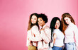 © iordani - different nation girls with diversuty in skin, hair. Asian, scandinavian, african american cheerful emotional posing on pink background, woman day celebration, lifestyle people concept