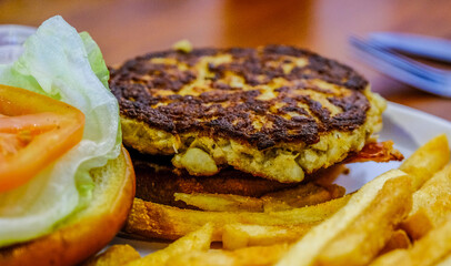 Wall Mural - Crab Cake Sandwich with Lettuce and Tomaro