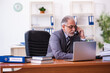 © Elnur - Old male businessman employee working in the office