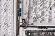 © marcinjozwiak - Aerial view of the trucks unloading at the logistic center. Drone photography.