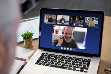 Poster - Diverse business people displayed on laptop screen during office video call