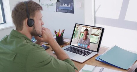 Poster - Caucasian man using laptop and phone headset on video call with male colleague