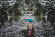 © Cavan Images - Girl with stuffed toy standing at backyard during winter