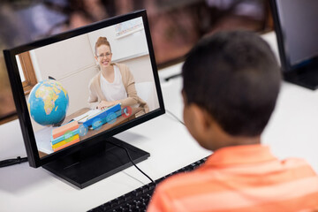 Sticker - Male student having a video call with female teacher on computer at school