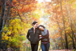 © Cavan Images - Happy couple walking in forest