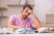 © Elnur - Young male student preparing for exams at home