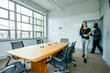 © Cavan Images - Blurred motion of business people entering in boardroom