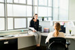 © Cavan Images - Businesswomen talking while sitting in office