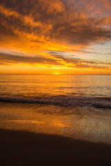 Poster - A beautiful sunrise from the shore of the beach