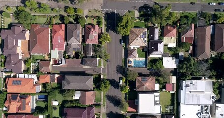 Wall Mural - Aerial rooftops of quiet residential houses on local streets in Sydney as 4k.
