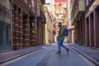 © Marian - Man crossing the street with backpack on his back