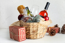 Gift Basket With Products And Christmas Decor On Light Background