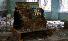 Old Rusty Cash Register In Abandoned Shop In Lost City After Nuclear Disaster 
