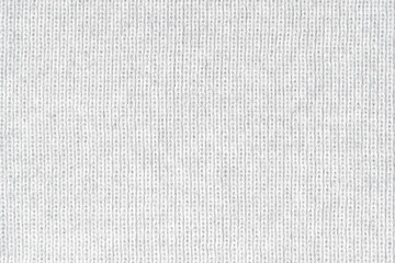 White natural texture of knitted wool textile material background. White crochet cotton fabric woven canvas texture. close up