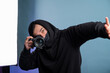 © Alexander - Portrait of positive photographer, man with medical mask holding professional digital dslr camera