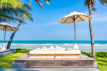 Sticker - Umbrella and chair around sea beach ocean with coconut palm tree