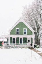 A Nineteenth Century New England Home Buried In The Snow In Spring.