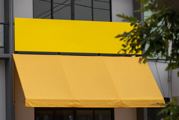 Wall Mural - blank yellow sign and canvas awning. exterior canvas roof.