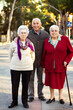 © Cavan Images - Portrait of senior adults standing on road