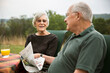 © Cavan Images - Senior couple talking while sitting at breakfast table