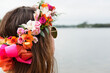 © Cavan Images - Close-up rear view of teenager wearing artificial flowers