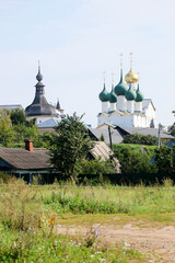 Summer view to famous russian landmark Rostov the great kremlin surrounded by green trees