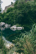 © Cavan Images - still river among rocks