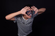 © Denis - Funny young man in a sailor suit. Diving mask and snorkel. Striped clothing. Black background.