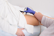 The Doctor Makes An Ultrasound Of The Veins And Arteries Of The Lower Extremities.