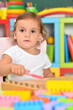 © aletia2011 - little girl playing with colorful plastic blocks