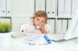© aletia2011 - Cute little girl using phone in office