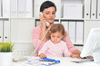© aletia2011 - Portrait of  businesswoman with her child  working in office