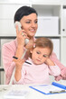 © aletia2011 - Portrait of  businesswoman with her child  working in office