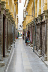 Sticker - empty and narrow pedestrian alley in the heart of the old city center in Granada