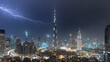 Dubai skyline and Burj Khalifa under stormy night sky with lightning