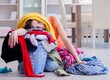 © Elnur - Stressed woman doing laundry at home