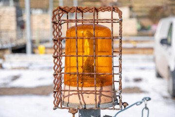 Yellow warning light protected in wire cage