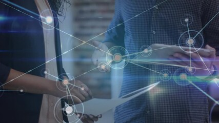 Poster - Network of connections against mid section of diverse male and female office colleagues shaking hand
