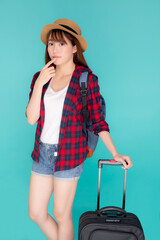 Wall Mural - Beautiful young asian woman pulling suitcase isolated on blue background, asia girl having expression is cheerful holding luggage walking in vacation with excited, journey and travel concept.