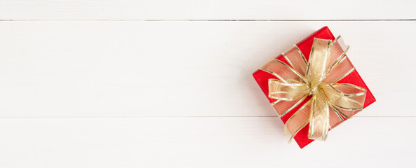 Canvas Print - Red gift box on wooden table background, love and romance, presents in celebration and anniversary with surprise on desk, happy birthday, donate and charity, valentine day 14 February concept.